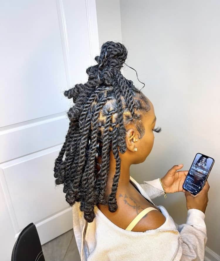 Invisible locs with a top knot Hairstyle