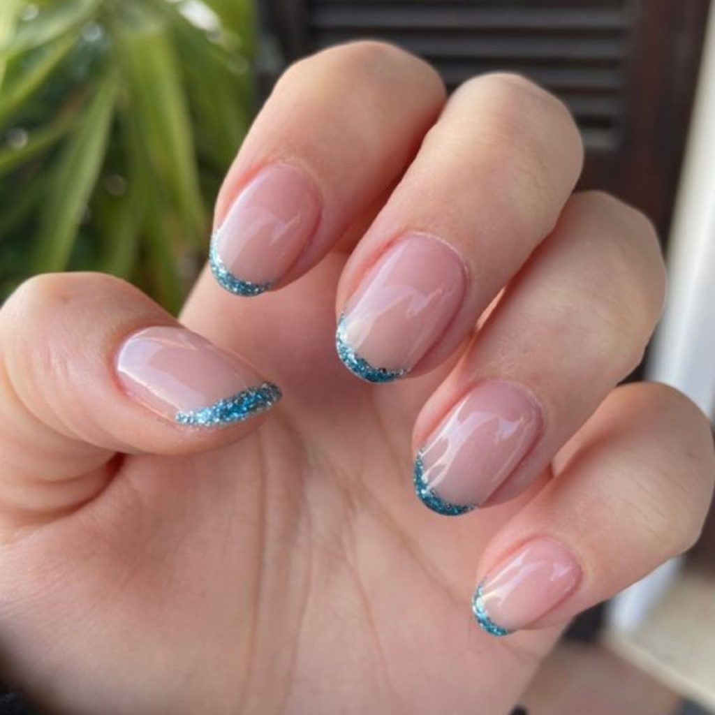 Sky Blue French Tip With A Glittery Accent Nail