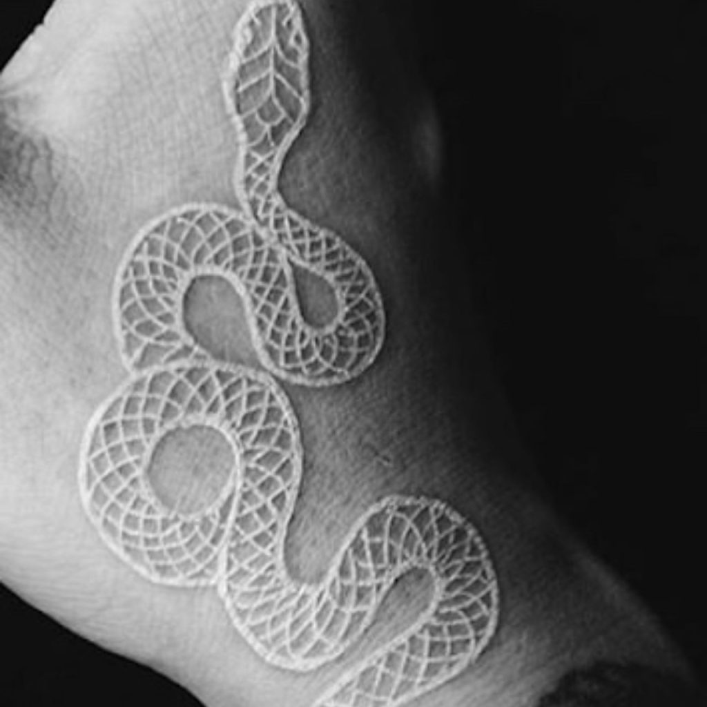 Snake White Ink Tattoo for bold Appearance