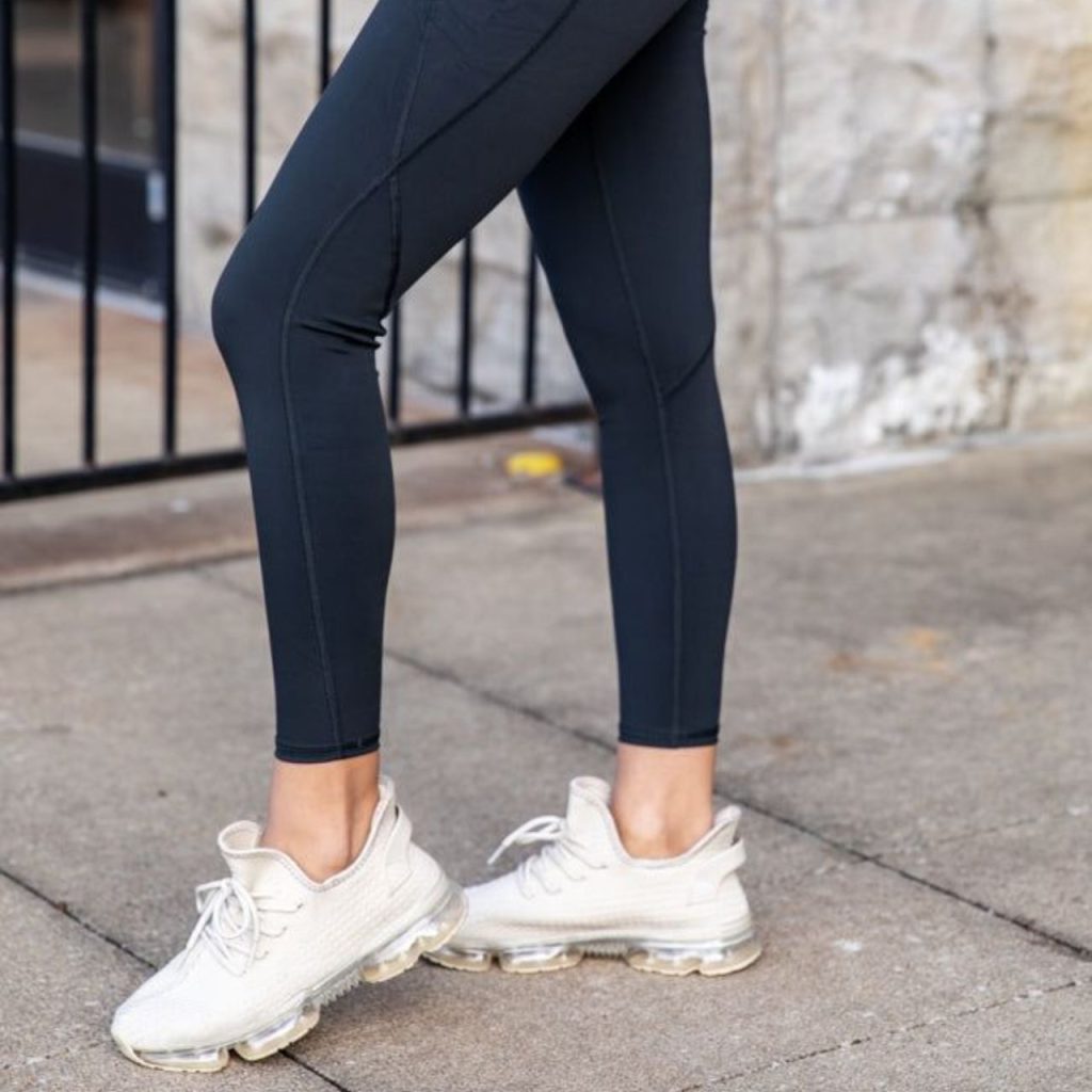 Sneakers Paired With Black Leggings  