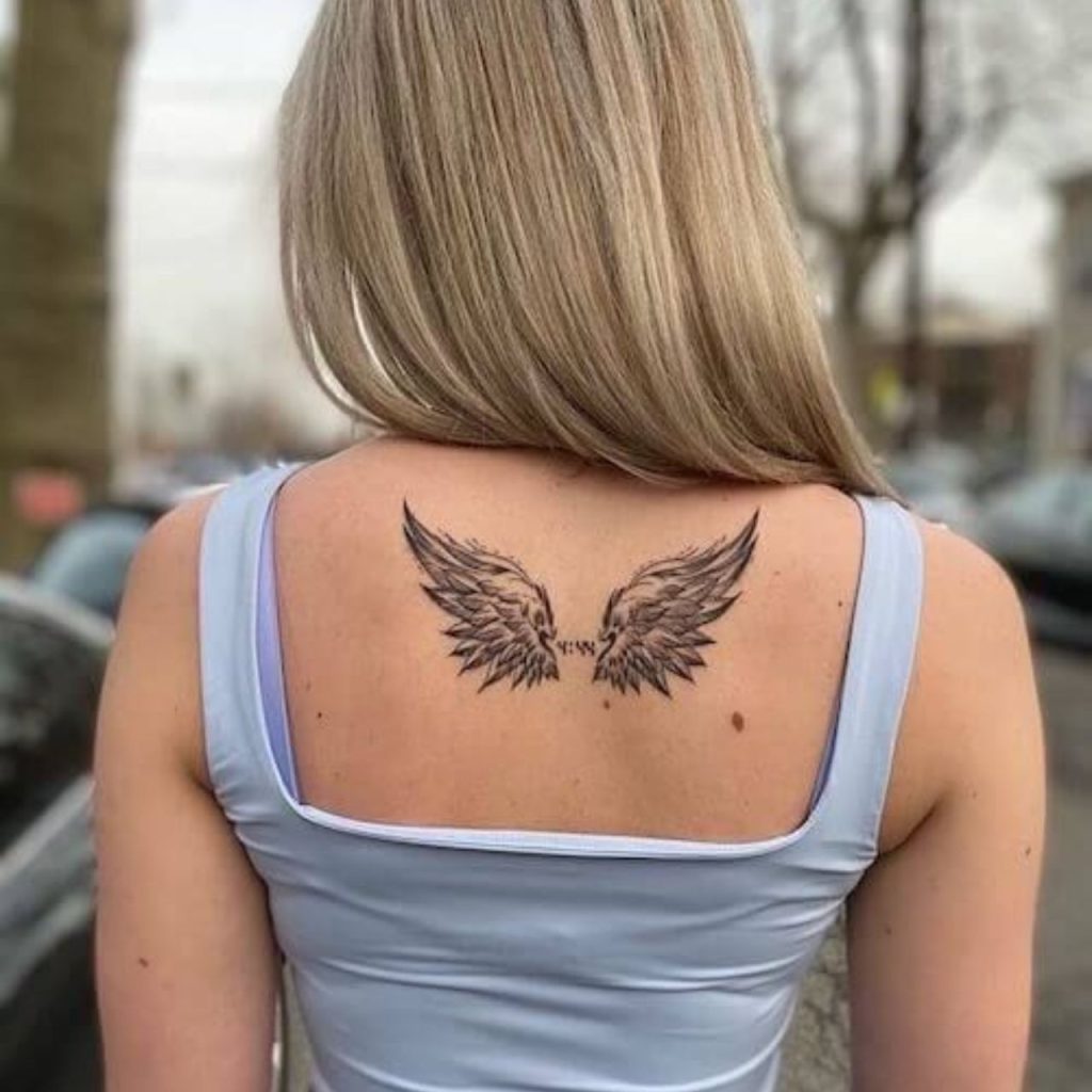 Wings on the back Female Tattoo Designs